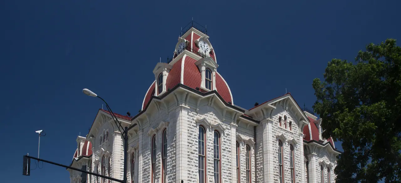 The clock tower of the Parker County Courthouse in downtown Weatherford, Texas